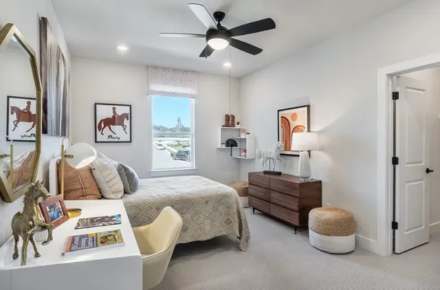 a bedroom with a bed and a table