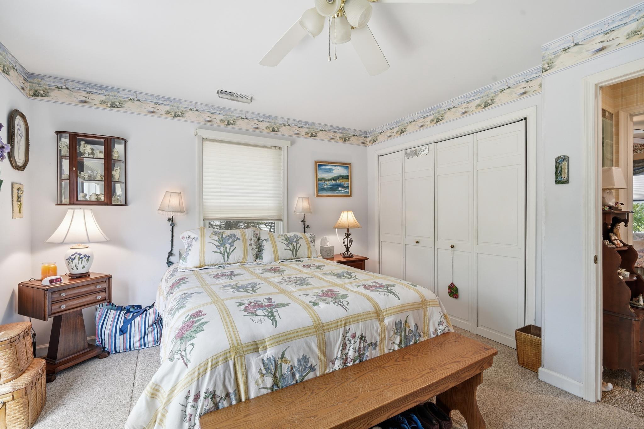 14136 Kentmore Park Road Kennedyville, MD 21645 - Photo 27 of 54 a bedroom with a bed and a table in it