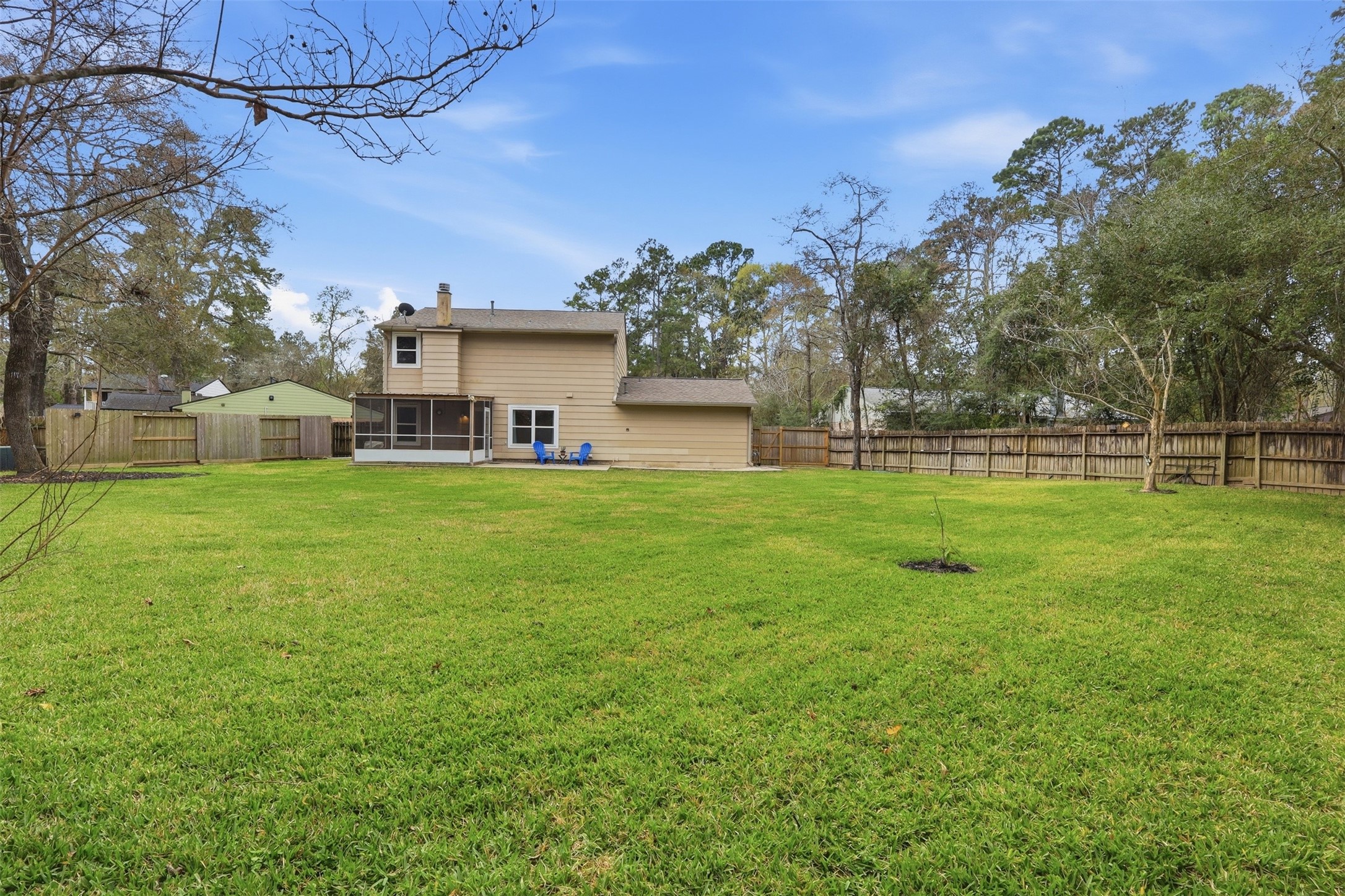 10 East Broken Oak Court Spring, TX 77381 - Photo 27 of 31 A spacious back yard with a sunroom and plenty of privacy is perfect for hosting, or enjoying the Texas sky with family. Perfect size for a pool!