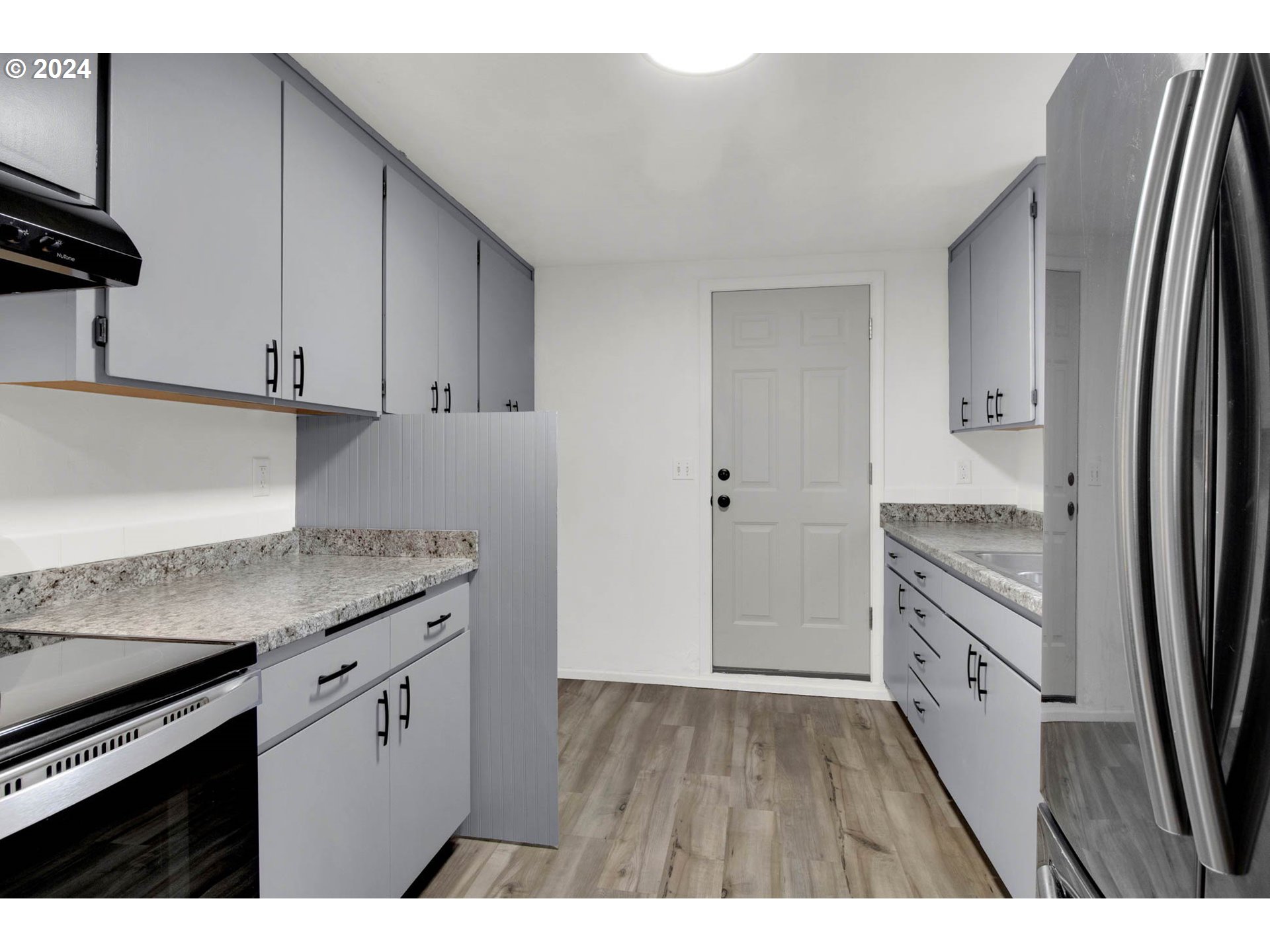 2224 Ohio Street Eugene, OR 97402 - Photo 16 of 31 a kitchen with stainless steel appliances granite countertop a refrigerator and a stove