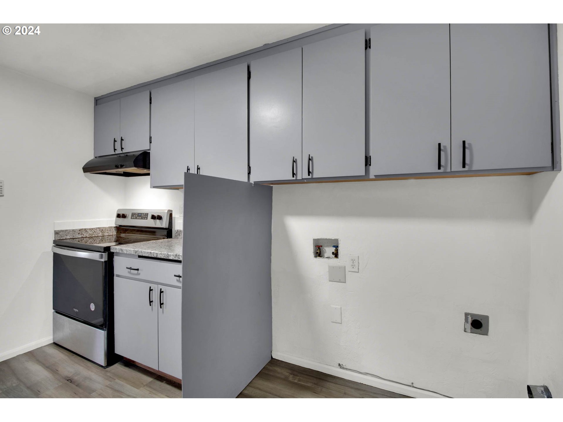 2224 Ohio Street Eugene, OR 97402 - Photo 21 of 31 a kitchen with cabinets and appliances