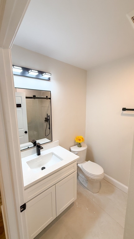 122 Copperfield Road Worcester, MA 01602 - Photo 21 of 28 a bathroom with a sink a toilet and mirror