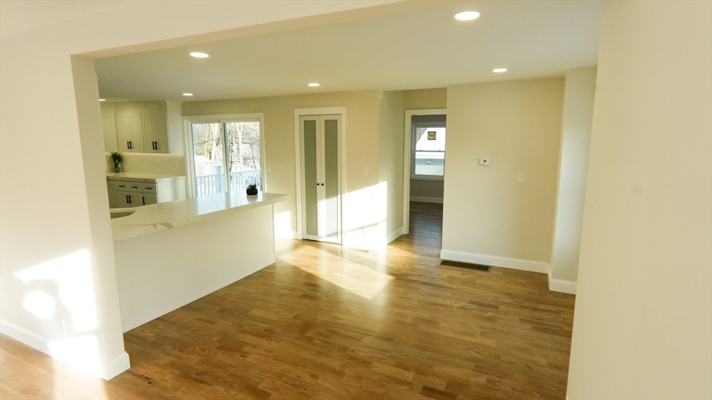 122 Copperfield Road Worcester, MA 01602 - Photo 4 of 28 a view of a big room with wooden floor and windows
