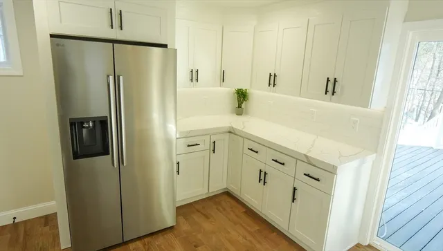 a bathroom with a double vanity sink a mirror and a shower