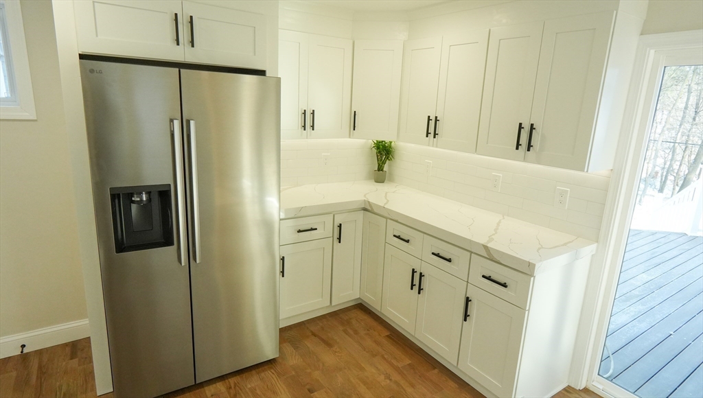 122 Copperfield Road Worcester, MA 01602 - Photo 8 of 28 a bathroom with a double vanity sink a mirror and a shower
