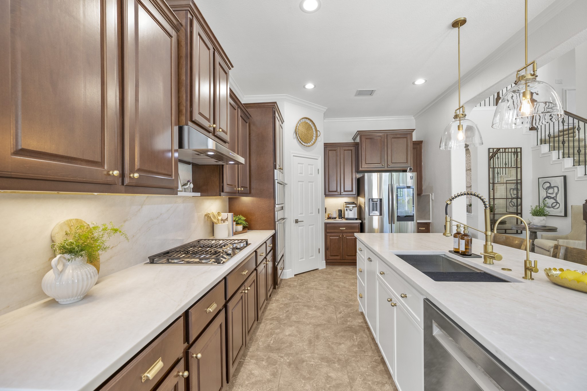 26 Winhall Place The Woodlands, TX 77354 - Photo 15 of 49 Rich wood cabinetry provides plenty of storage.