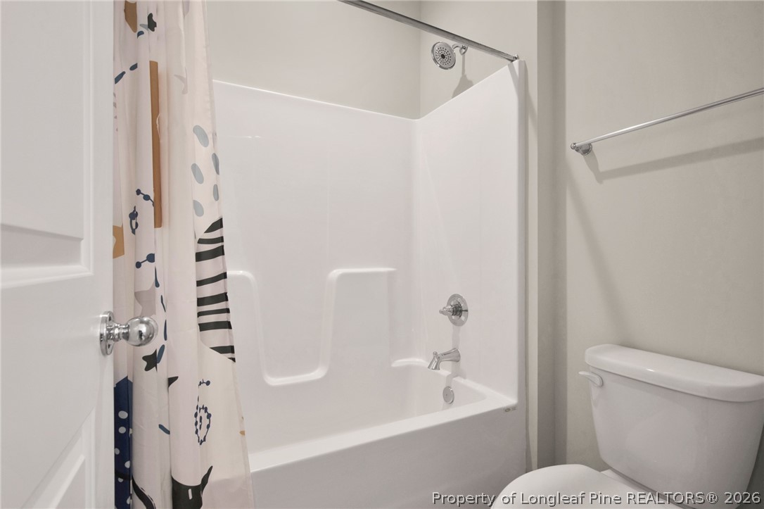 224 Timber Skip Drive Spring Lake, NC 28390 - Photo 22 of 30 a bathroom with a bathtub and shower
