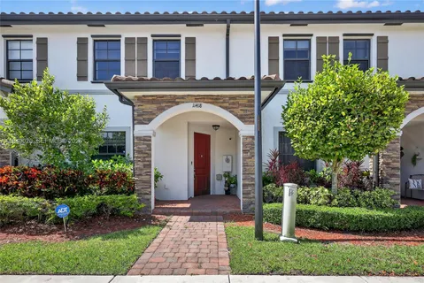 front view of a house with a garden