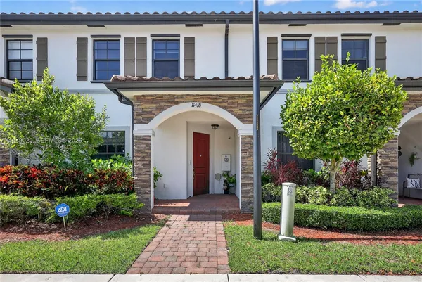 front view of a house with a garden