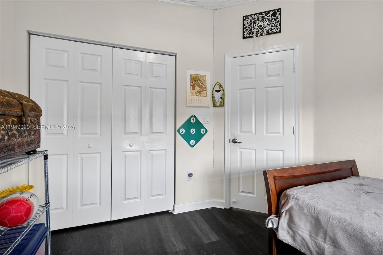 11418 Southwest 250th Street Homestead, FL 33032 - Photo 31 of 57 a bedroom with a bed and a dresser