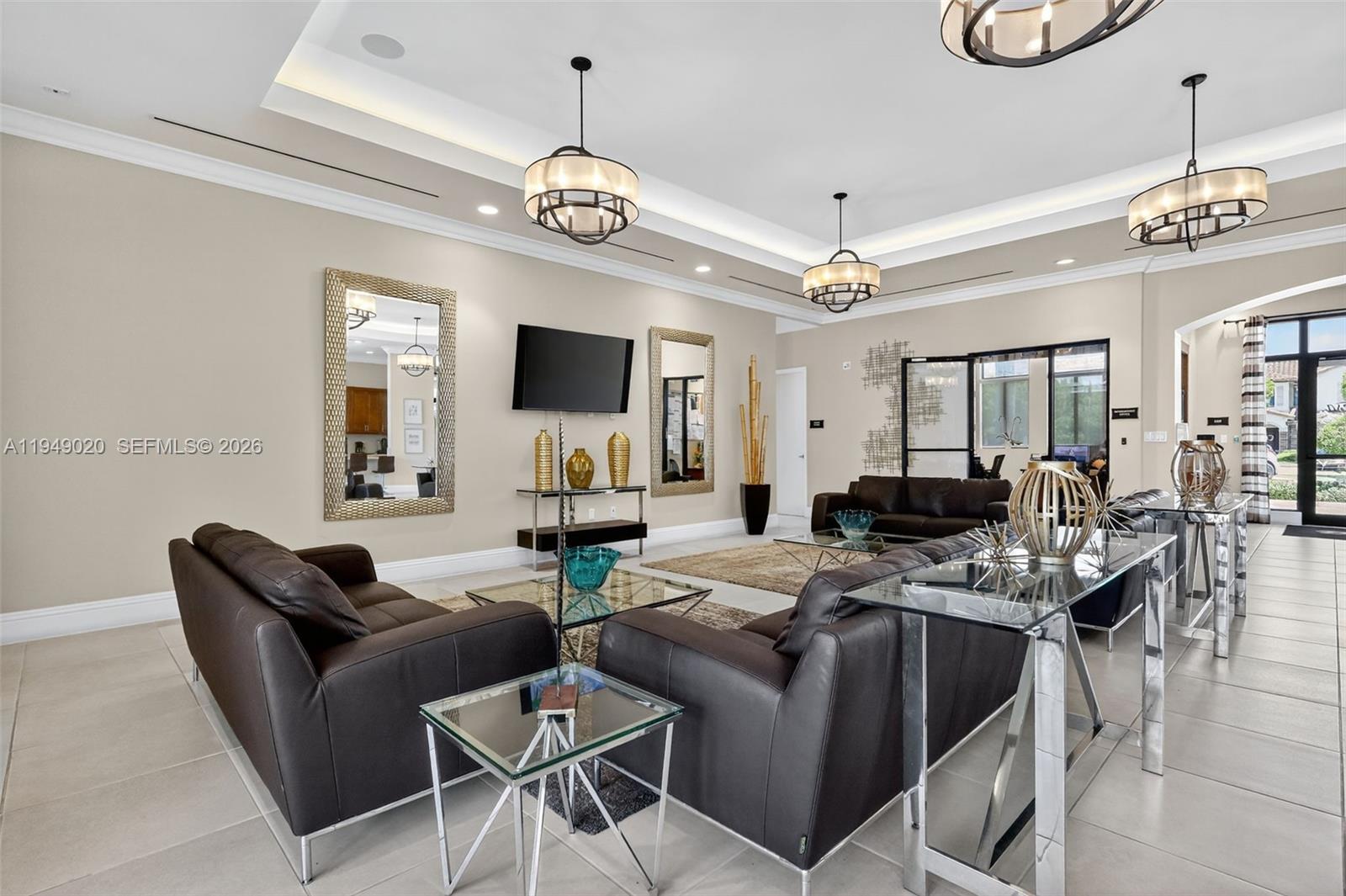 11418 Southwest 250th Street Homestead, FL 33032 - Photo 50 of 57 a view of a dining room with furniture a chandelier and wooden floor