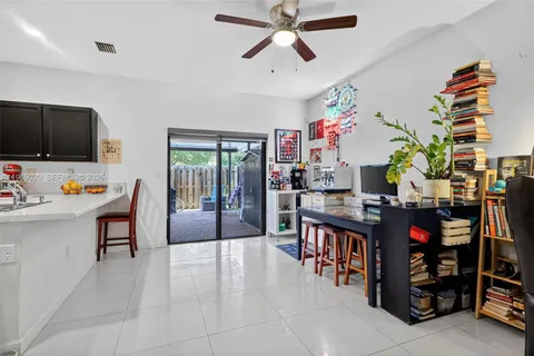 a living room filled with furniture and a flat screen tv
