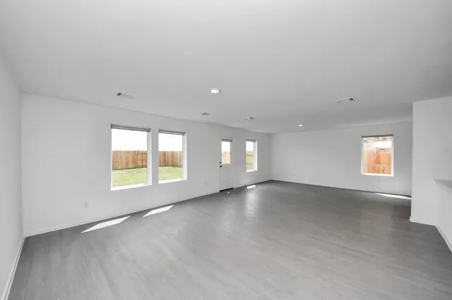 an empty room with windows