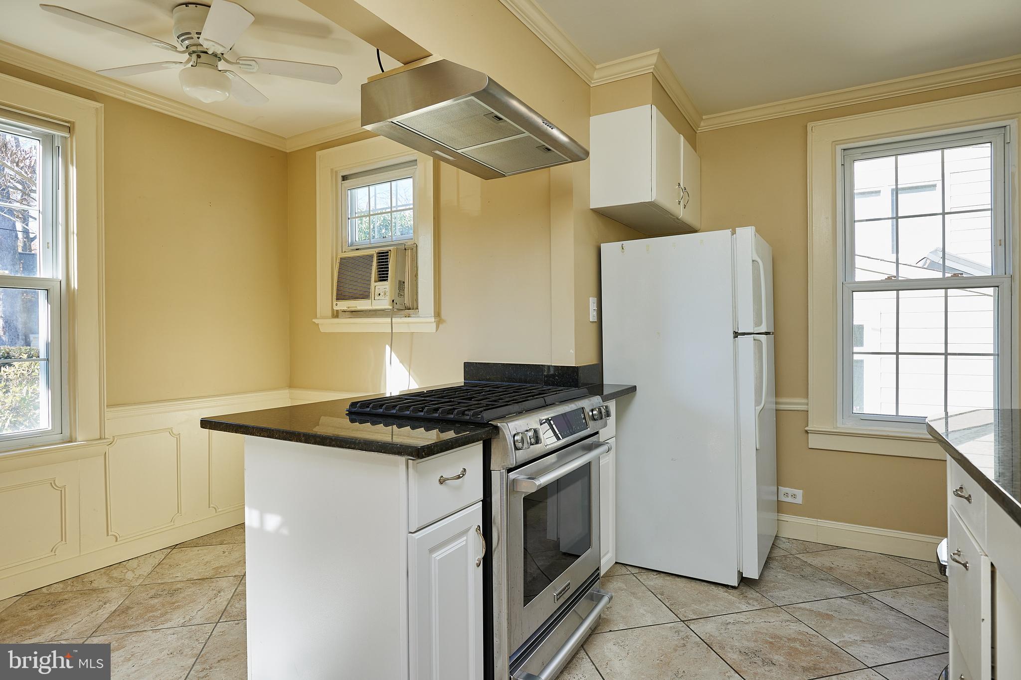 2913 24th Street North Arlington, VA 22207 - Photo 11 of 30 a kitchen with a stove a refrigerator and a sink