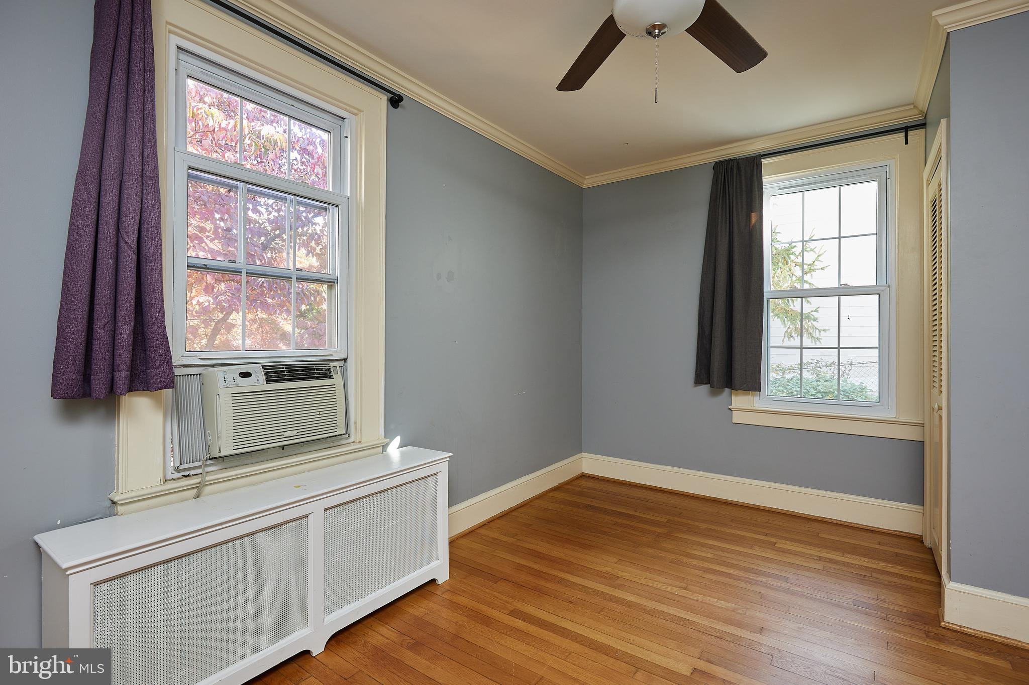2913 24th Street North Arlington, VA 22207 - Photo 13 of 30 an empty room with wooden floor and windows