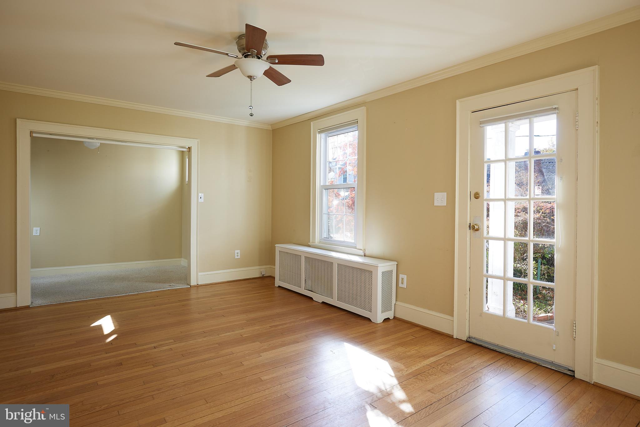 2913 24th Street North Arlington, VA 22207 - Photo 3 of 30 a view of an empty room with a window and wooden floor