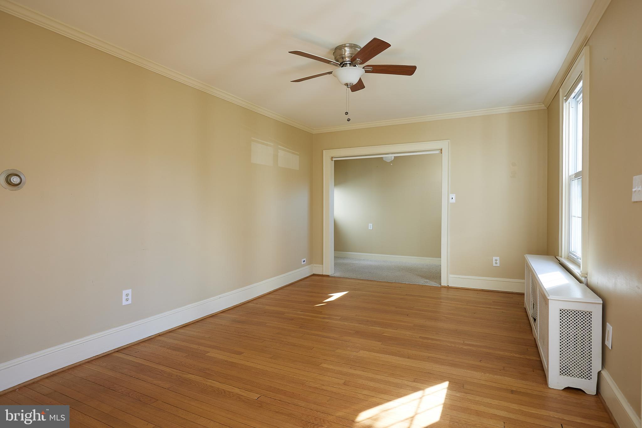 2913 24th Street North Arlington, VA 22207 - Photo 4 of 30 a view of empty room with wooden floor and fan