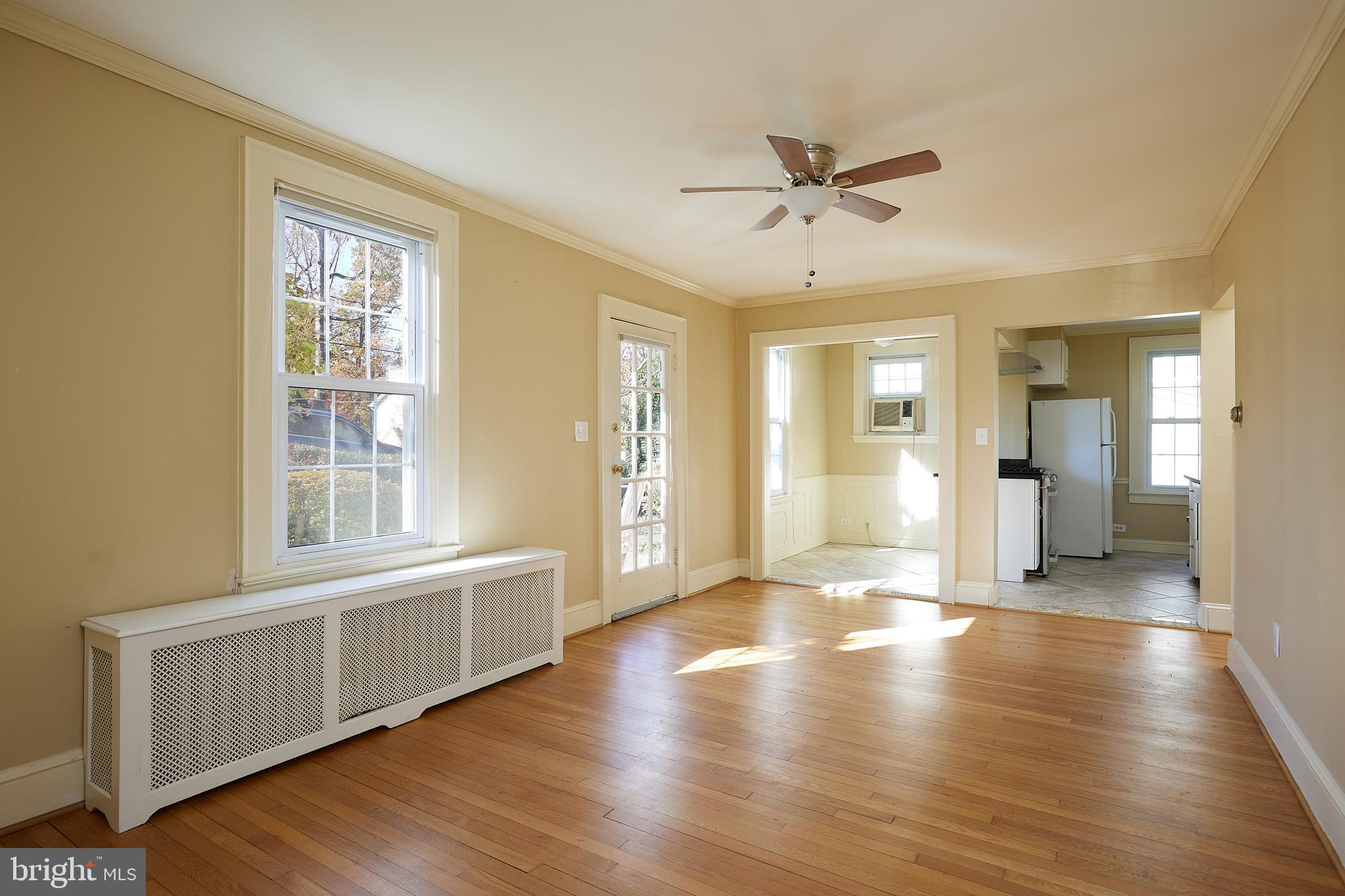 2913 24th Street North Arlington, VA 22207 - Photo 5 of 30 a view of an empty room with window and wooden floor