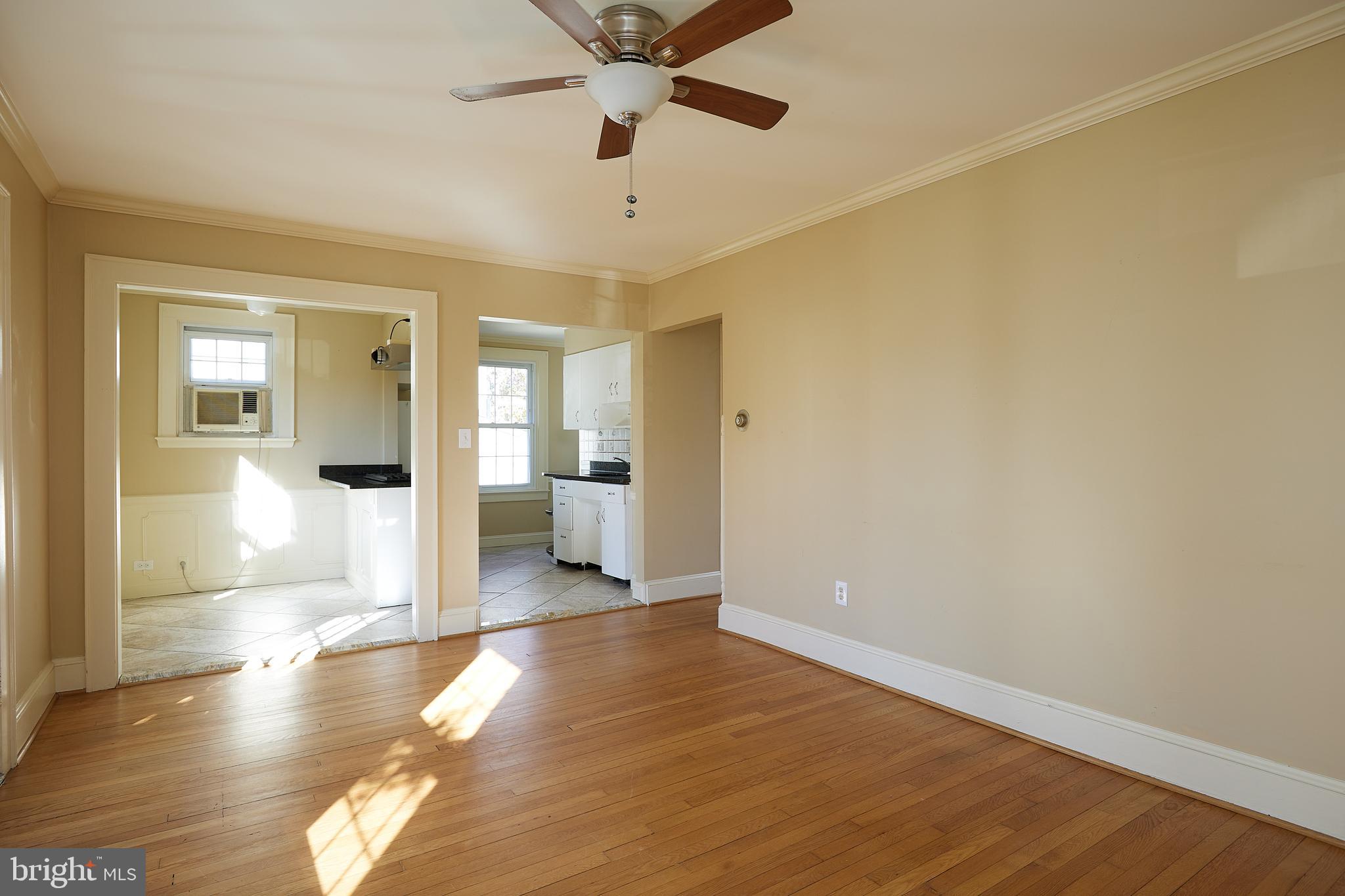 2913 24th Street North Arlington, VA 22207 - Photo 6 of 30 a view of a big room with wooden floor and a bathroom