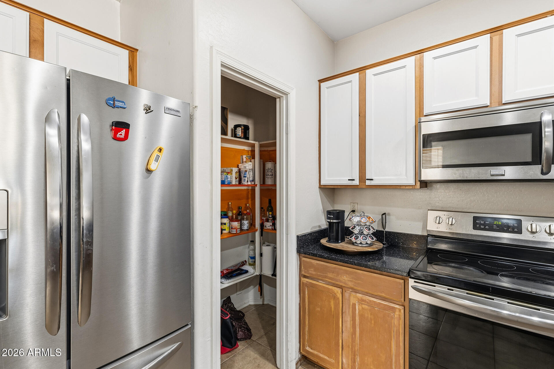 6718 West Darrel Road Laveen, AZ 85339 - Photo 35 of 49 a kitchen with stainless steel appliances granite countertop a refrigerator and a stove top oven