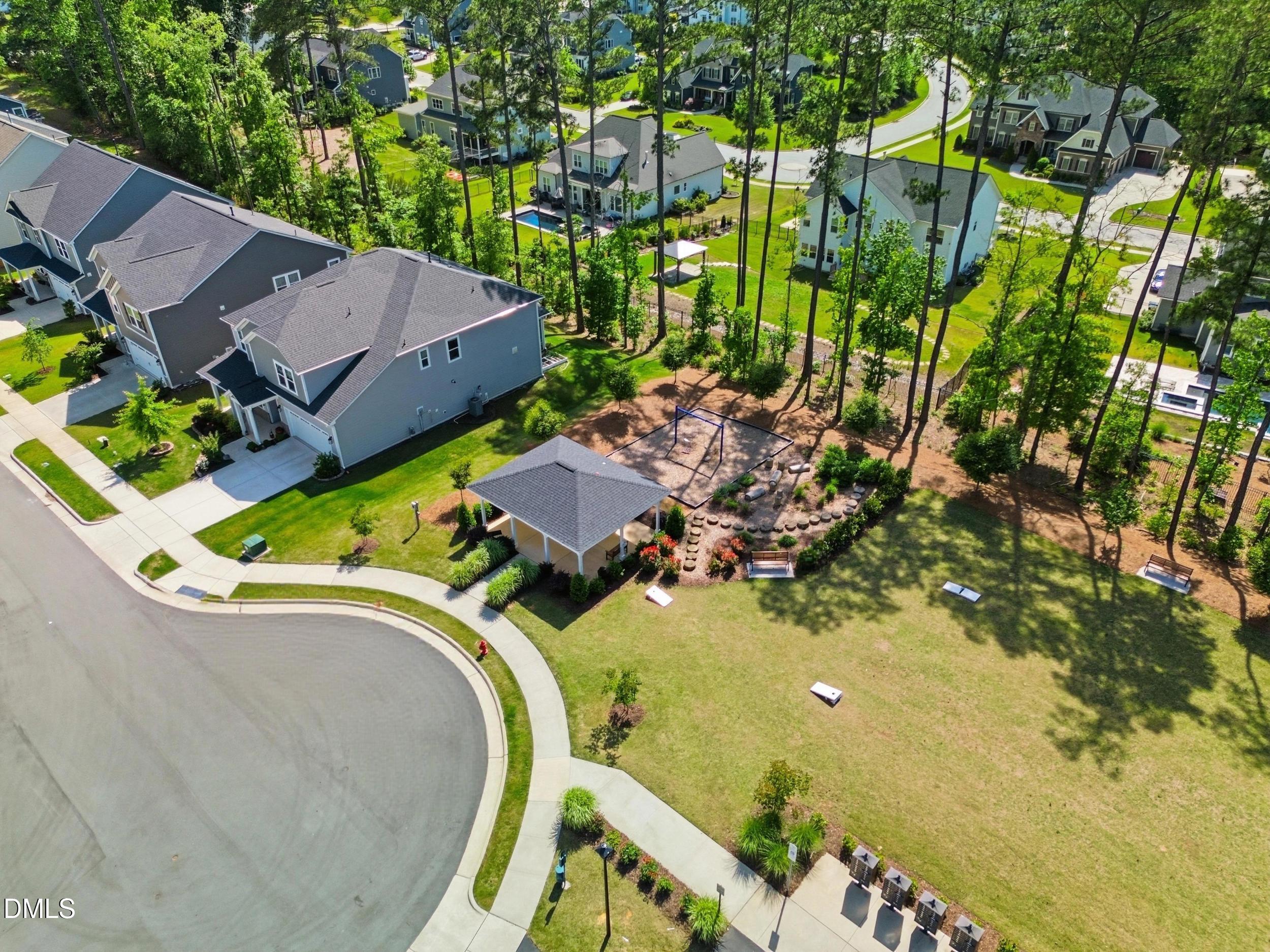 2709 Womble Ridge Drive New Hill, NC 27562 - Photo 55 of 60 an aerial view of a house with a swimming pool