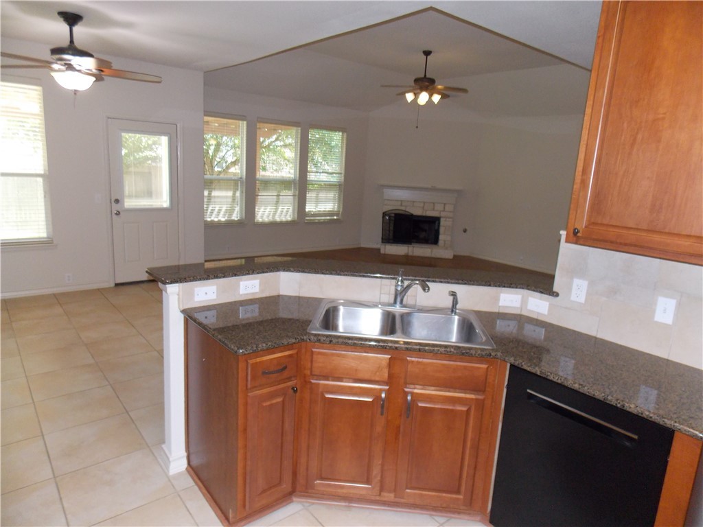 20961 Mandrake Drive Pflugerville, TX 78660 - Photo 19 of 34 a kitchen with cabinets and window