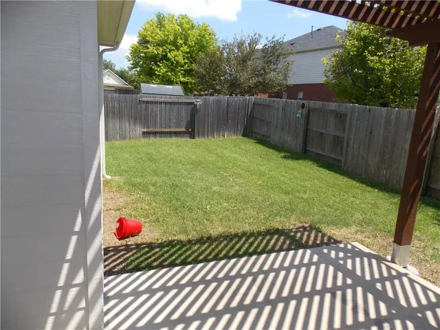 a view of backyard with green space