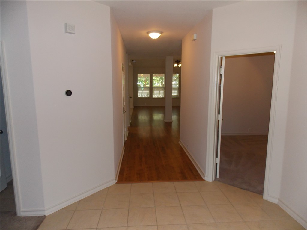 20961 Mandrake Drive Pflugerville, TX 78660 - Photo 3 of 34 a view of hallway with wooden floor