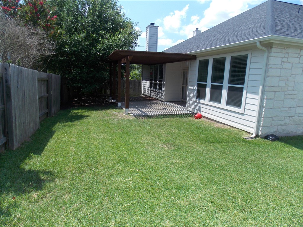 20961 Mandrake Drive Pflugerville, TX 78660 - Photo 31 of 34 a front view of a house with a yard