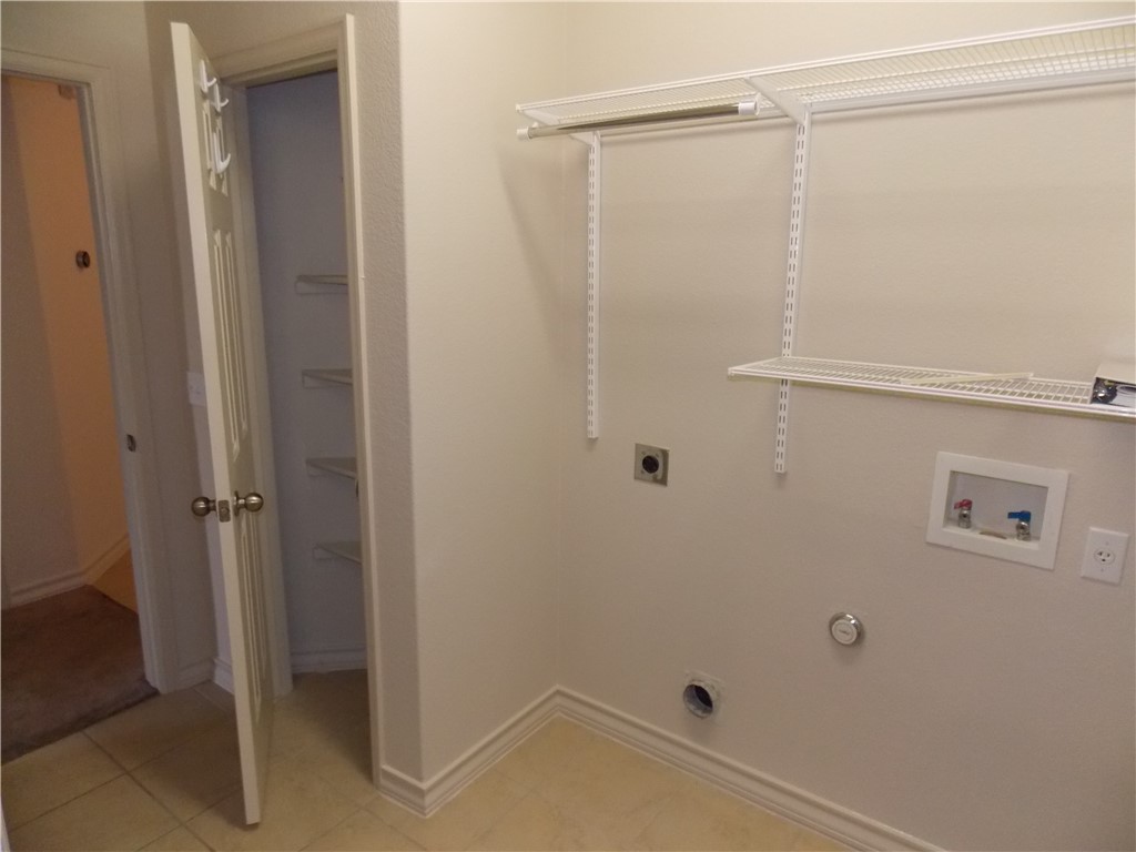 20961 Mandrake Drive Pflugerville, TX 78660 - Photo 34 of 34 a bathroom with a glass shower door