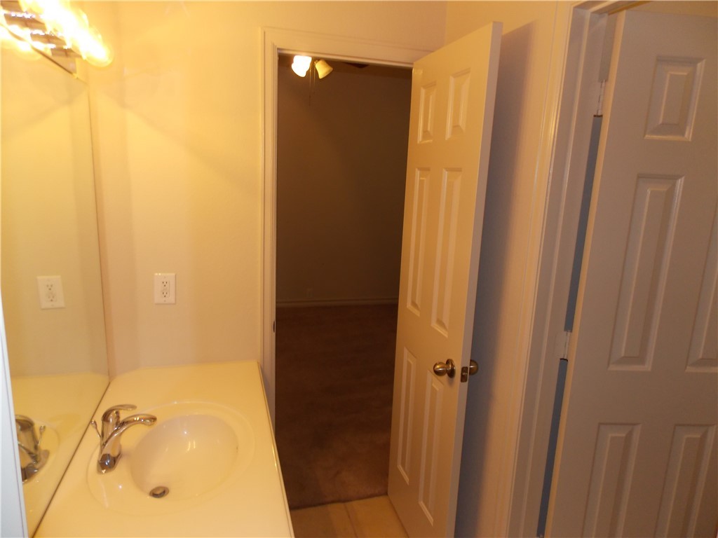 20961 Mandrake Drive Pflugerville, TX 78660 - Photo 9 of 34 a bathroom with a tub and shower