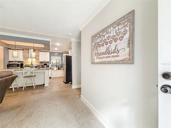 a kitchen with stainless steel appliances granite countertop a sink and a stove