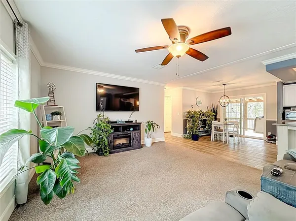 a kitchen with stainless steel appliances granite countertop a sink a stove and a wooden floors