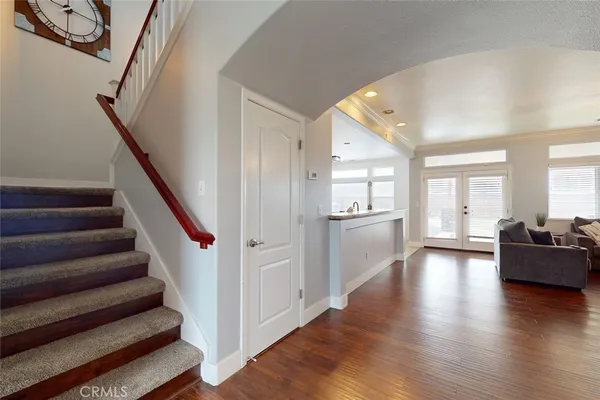 a view of an entryway with wooden floor and windows