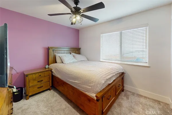 a bed room with a bed and a window