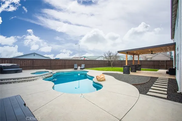a view of a swimming pool with a yard