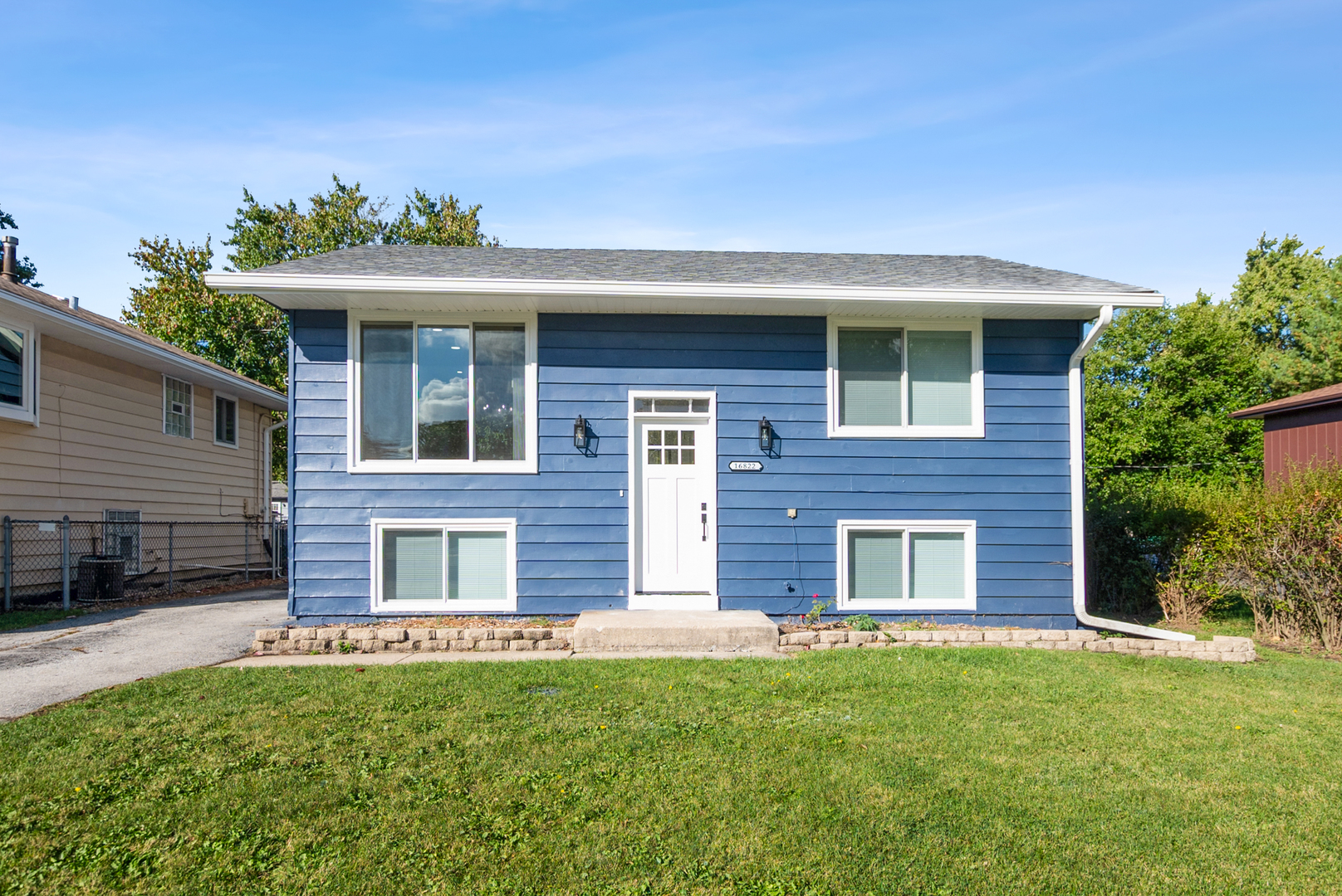 16822 91st Avenue Orland Hills, IL 60487 - Photo 1 of 21 a front view of a house with garden