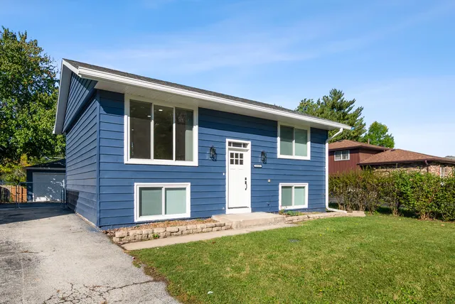 a brick house with a large windows