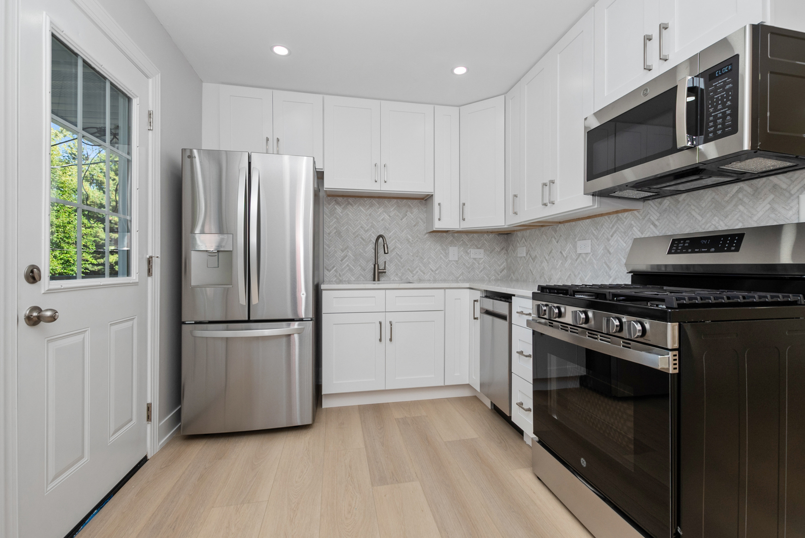 16822 91st Avenue Orland Hills, IL 60487 - Photo 8 of 21 a kitchen with stainless steel appliances a refrigerator stove and microwave
