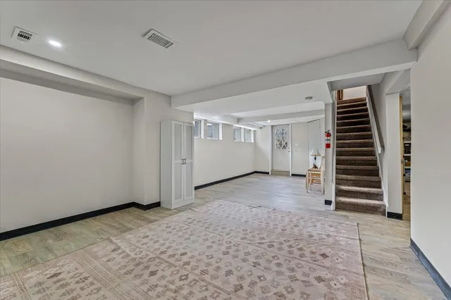 a view of an empty room with stairs
