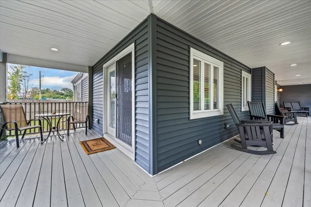 a view of a patio with a table and chairs