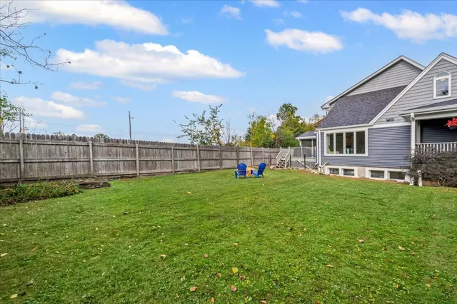 a view of a house with a backyard