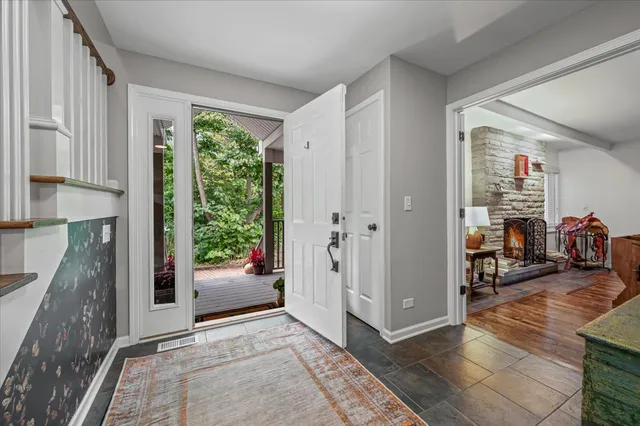 a view of a livingroom with furniture and front door