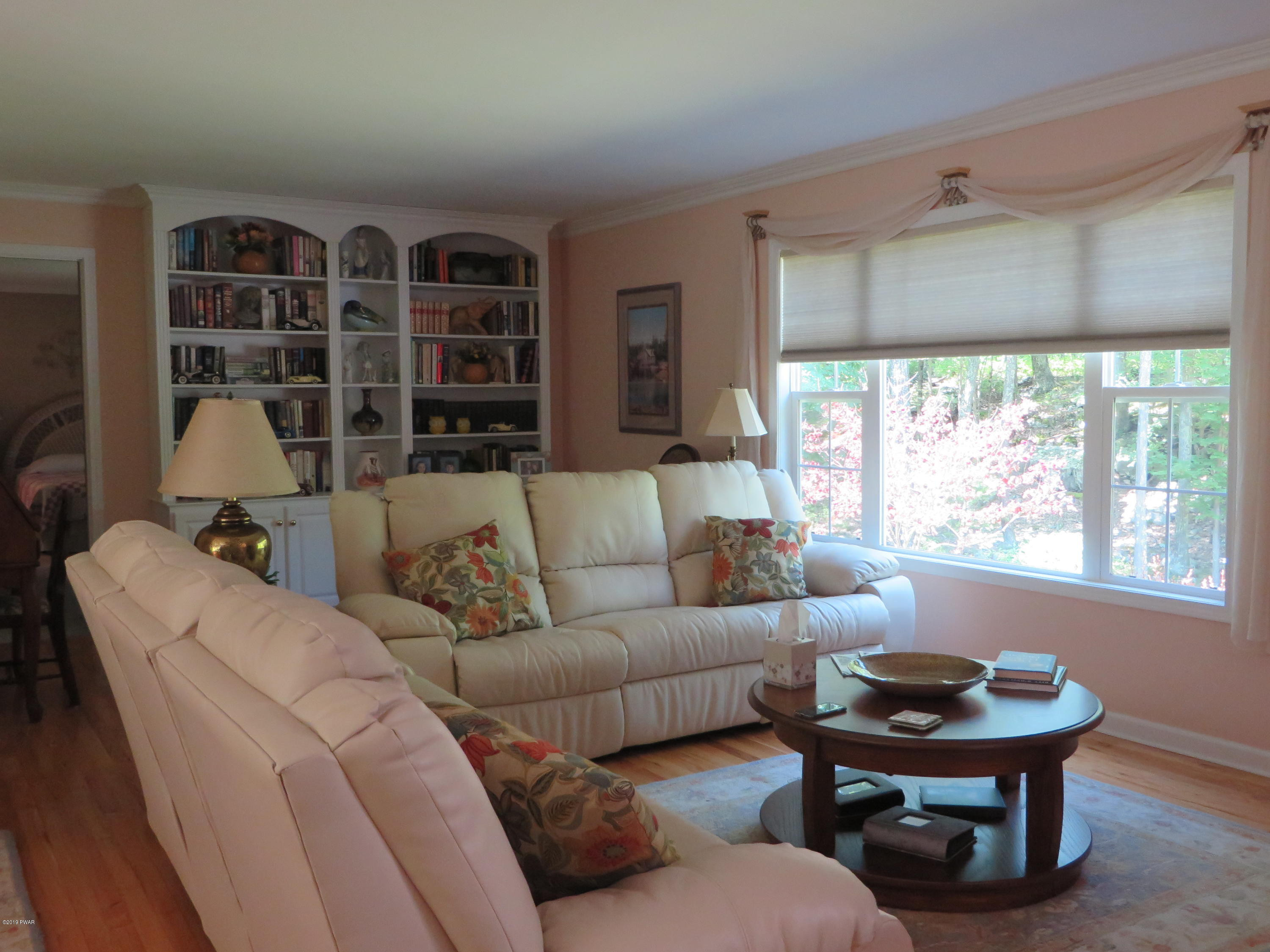 137 Maple Ridge Road Milford, PA 18337 - Photo 11 of 82 a living room with furniture and a large window