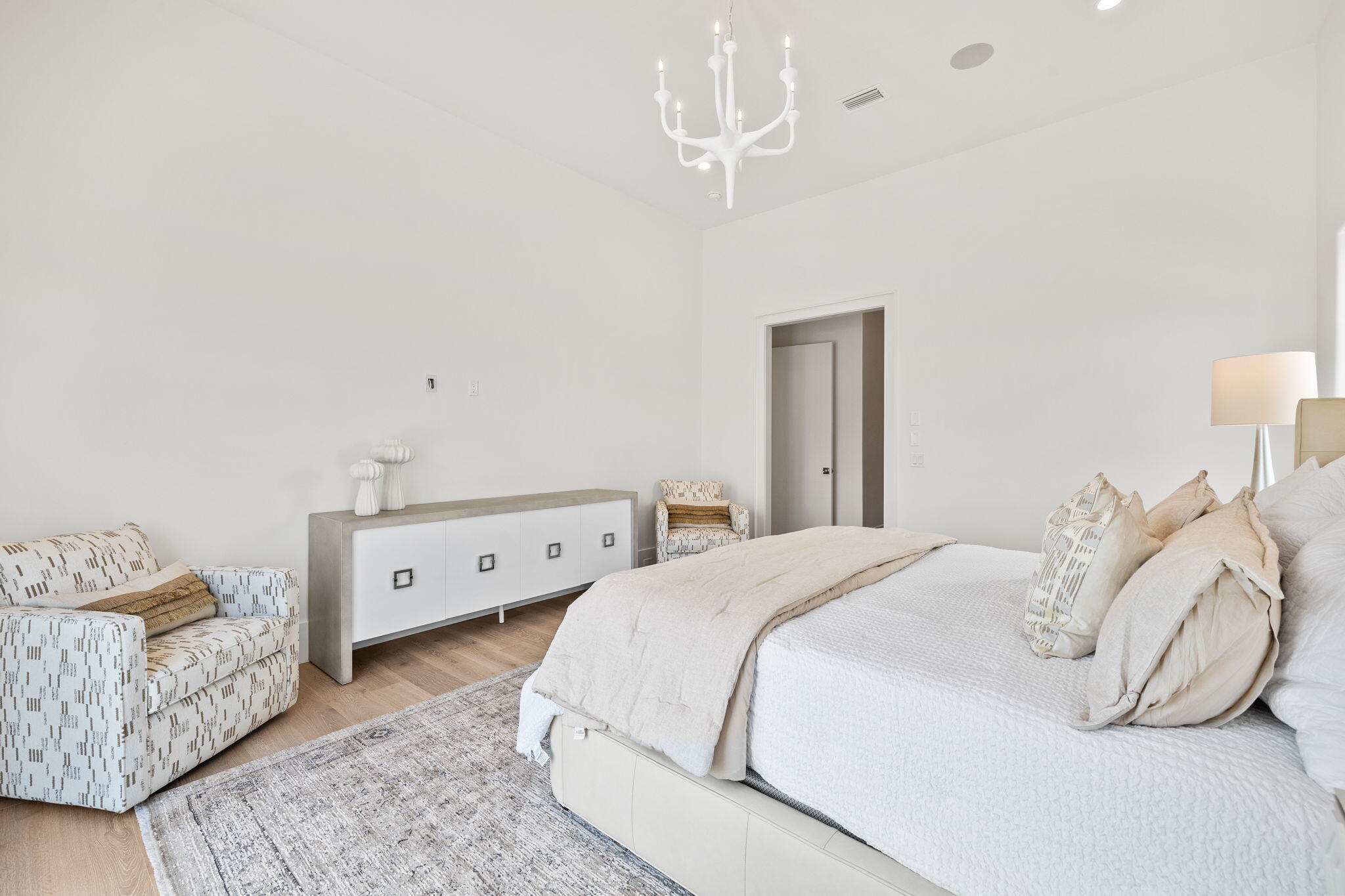 450 Windsong Dr Inlet Beach Inlet Beach, FL 32461 - Photo 42 of 90 a spacious bedroom with a bed and a chandelier