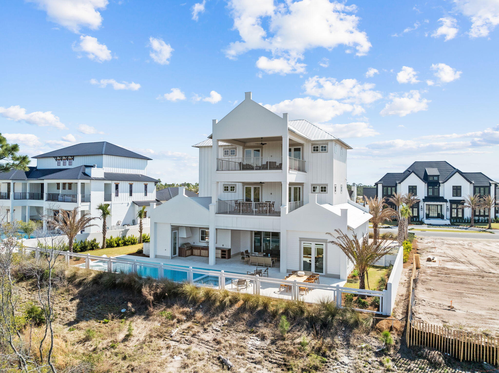 450 Windsong Dr Inlet Beach Inlet Beach, FL 32461 - Photo 76 of 90 a view of a big house with a big yard and large trees