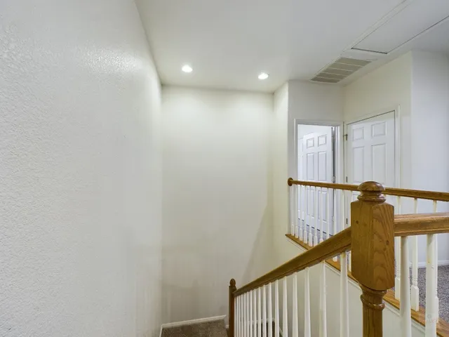 a view of a hallway with windows