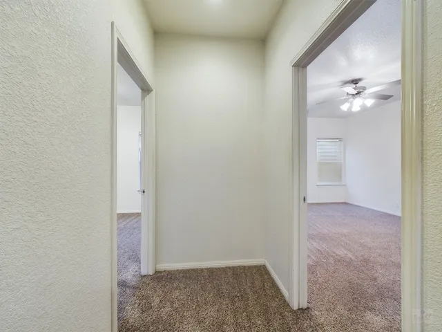 an empty room with a bathroom