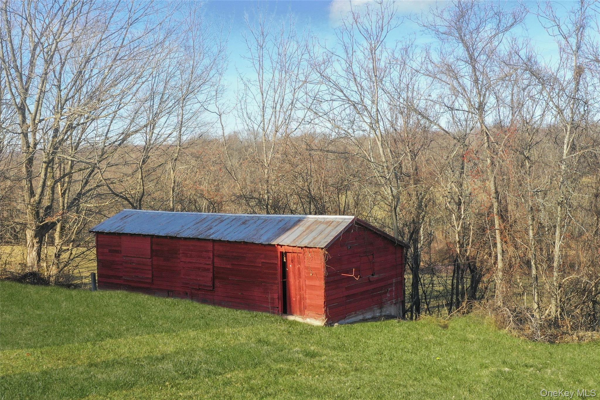 67 Jacobs Road Westtown, NY 10998 - Photo 6 of 36 View of pole building with a lawn and a view of trees