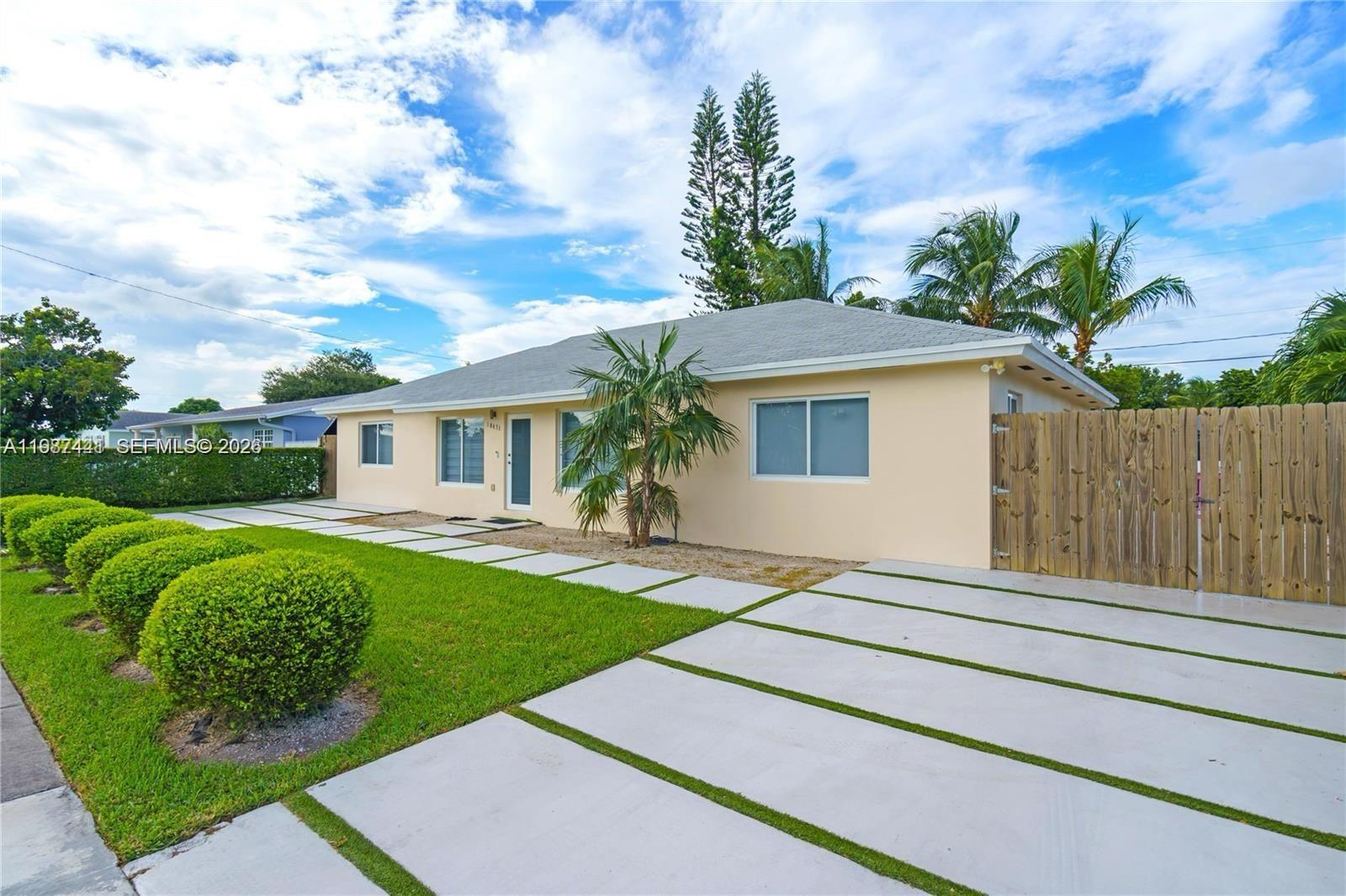 10471 Southwest 164th Street Miami, FL 33157 - Photo 2 of 15 a front view of a house with garden